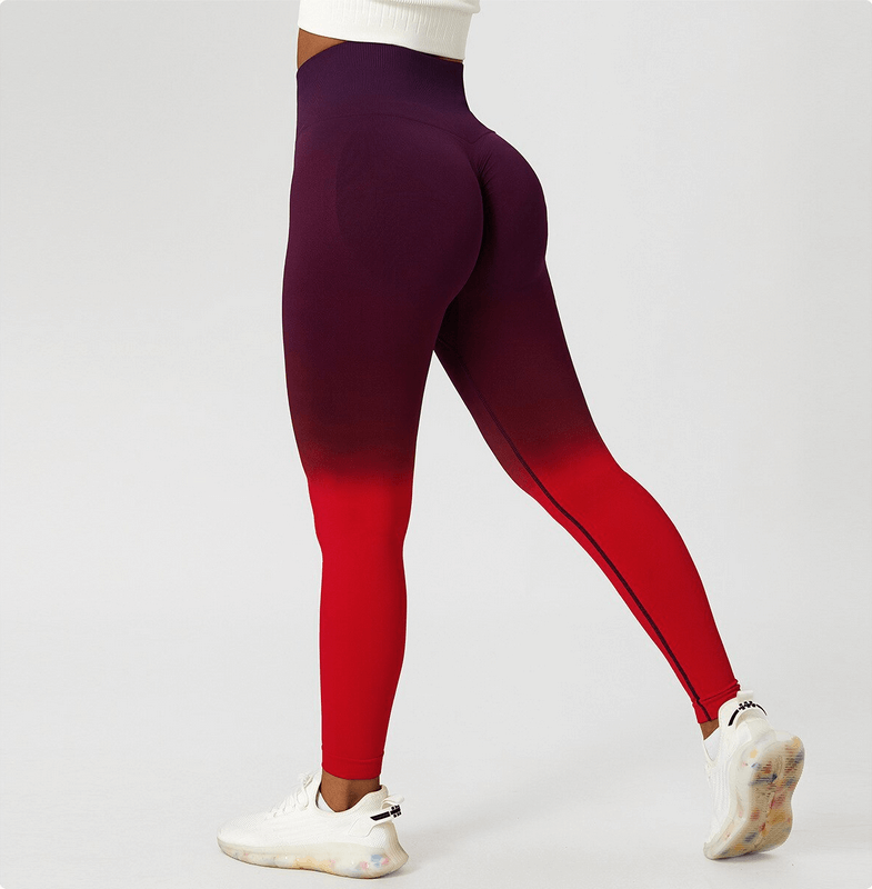 Woman wearing high waist gradient seamless leggings in red and purple, perfect for yoga and active sports.